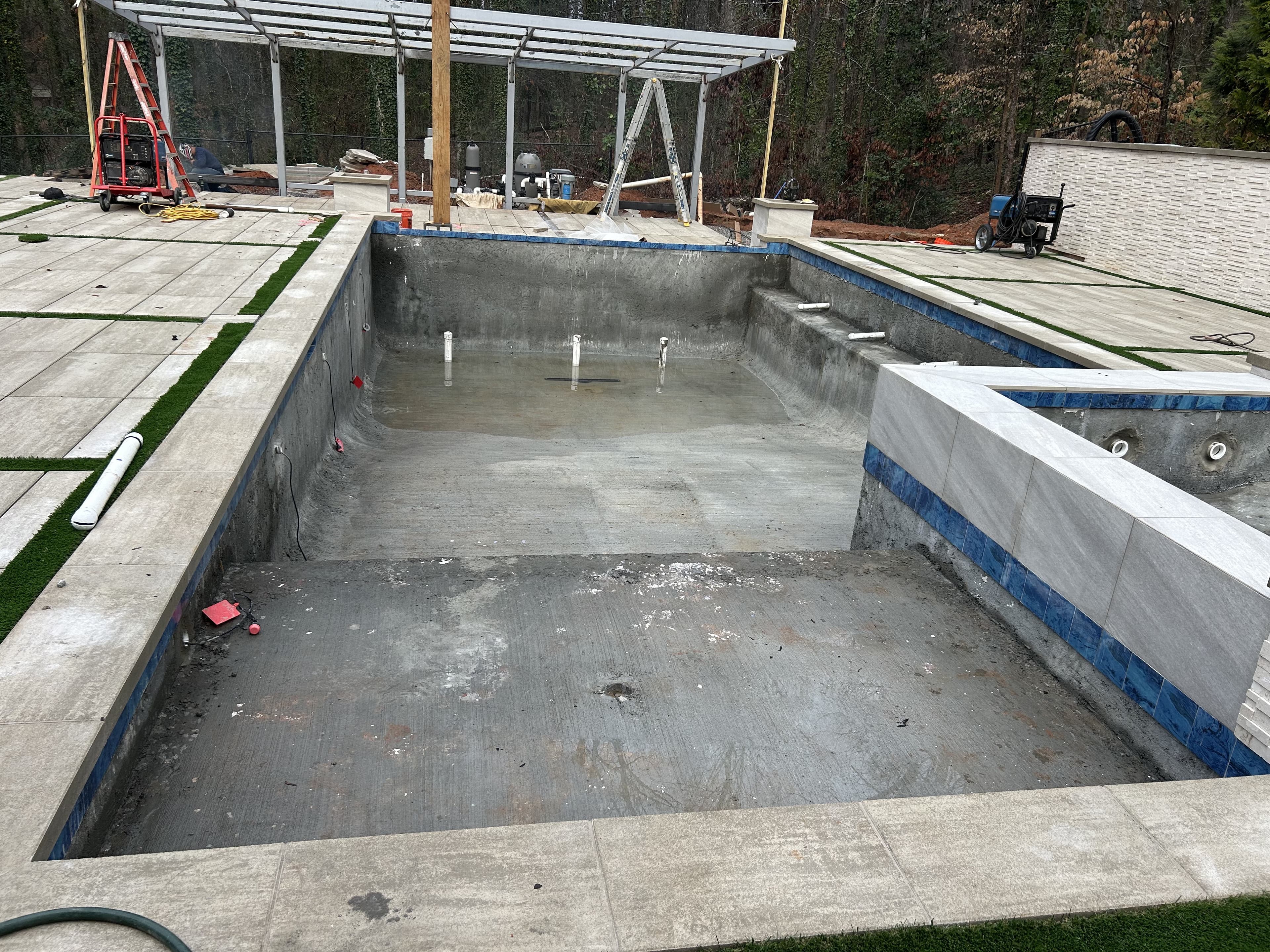 Pool shell construction with pergola framework