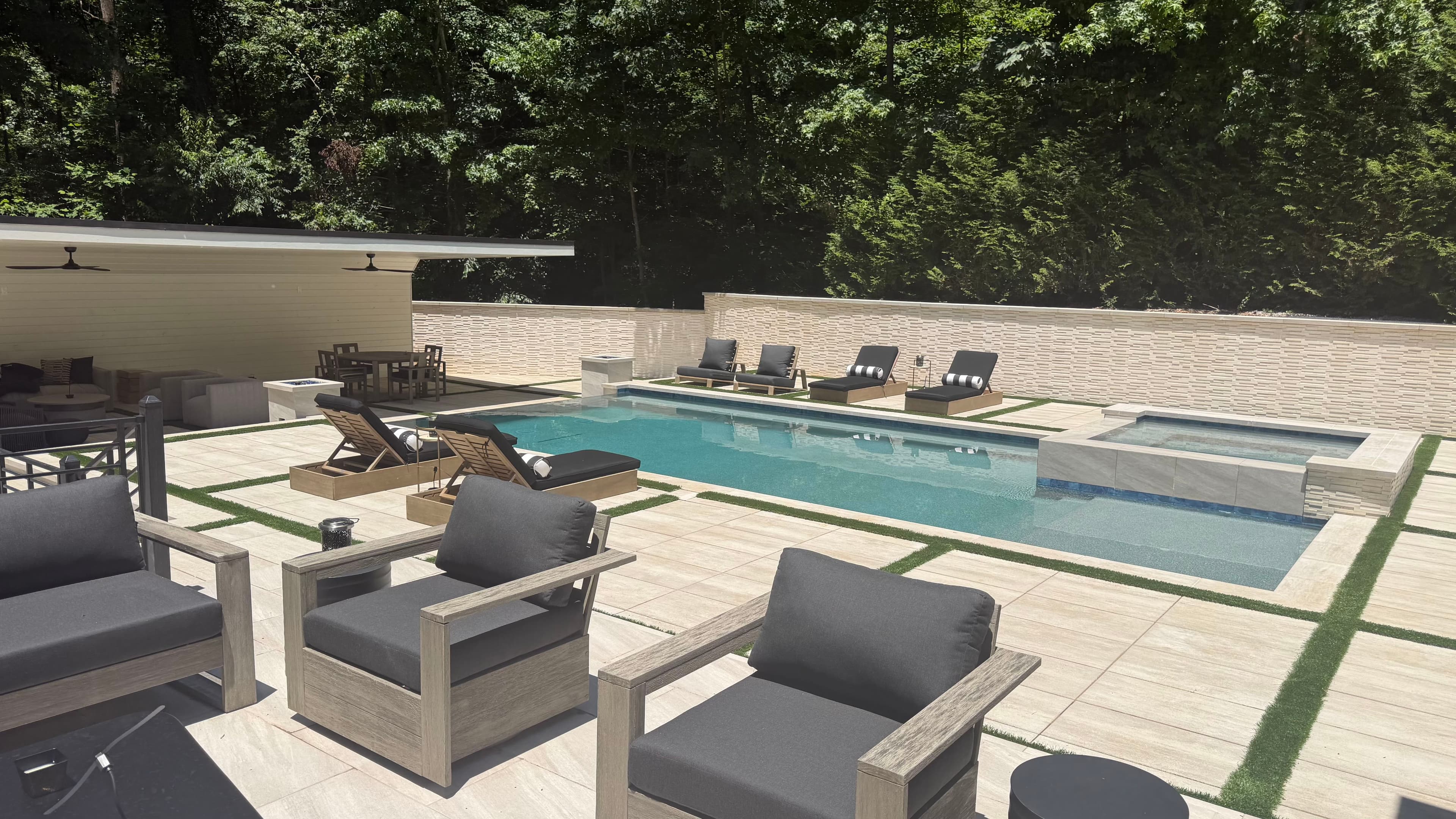 Outdoor seating area overlooking pool